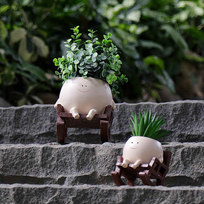 Handgefertigte Pflanzentöpfe im süßen Lach-Design